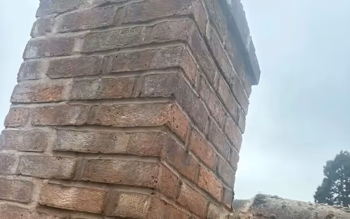 Chimney stack freshly repointed with new lead flashing