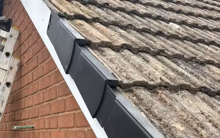 Dry verge caps being fitted along a gable edge