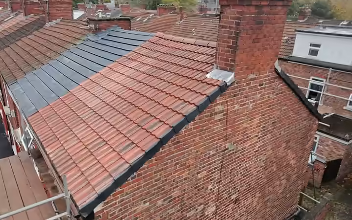 Drone view of new concrete tiles on a terraced house re-roof